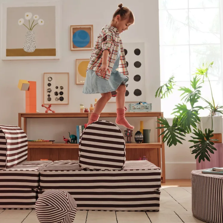 Child playing on a couch
