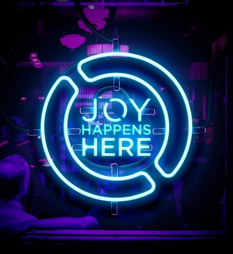 Joy happens here neon sign